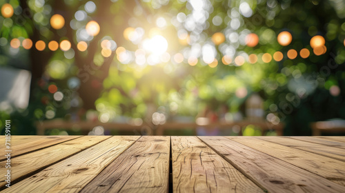 Wooden table with blurred garden background decorated for a party