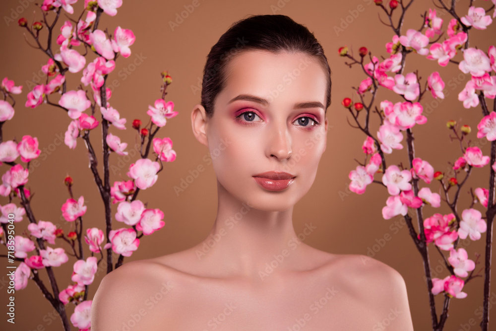 Photo of attractive tender gentle lady in cherry tree garden advertising oriental cultural therapy treatment