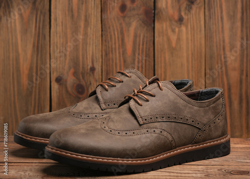 Obraz na plátne Pair of stylish men's brogue shoes on a wooden background