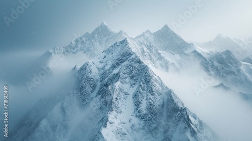 Snow-covered peaks  drone perspective  macro lens  overcast sky  minimalist  high-key photography.