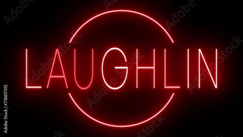 Flickering red retro style neon sign glowing against a black background for LAUGHLIN photo