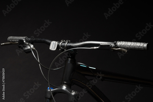 Close up of a bicycle against black background