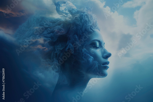 Conceptual image of a woman’s face is dissolving in to a cloudy sky photo