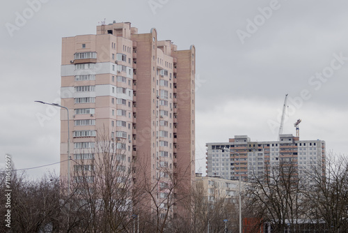 Kyiv, Ukraine - January 20, 2024: cozy sleeping district of Borshchagivka. school, cinema, houses nearby. new buildings and shopping centers are being built where people can buy everything they need photo