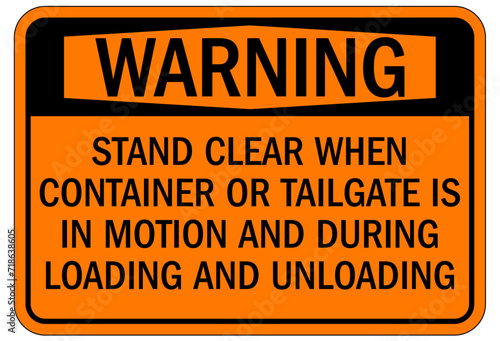 Truck warning sign and labels stand clear when container or tailgate is in motion and during loading and unloading