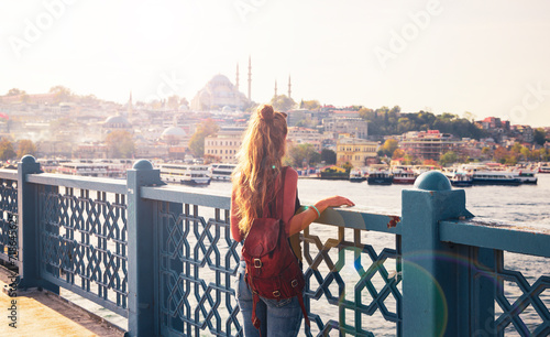 Woman tourist enjoying sunset view of Istanbul city- Travel, tourism, destination in Turkey