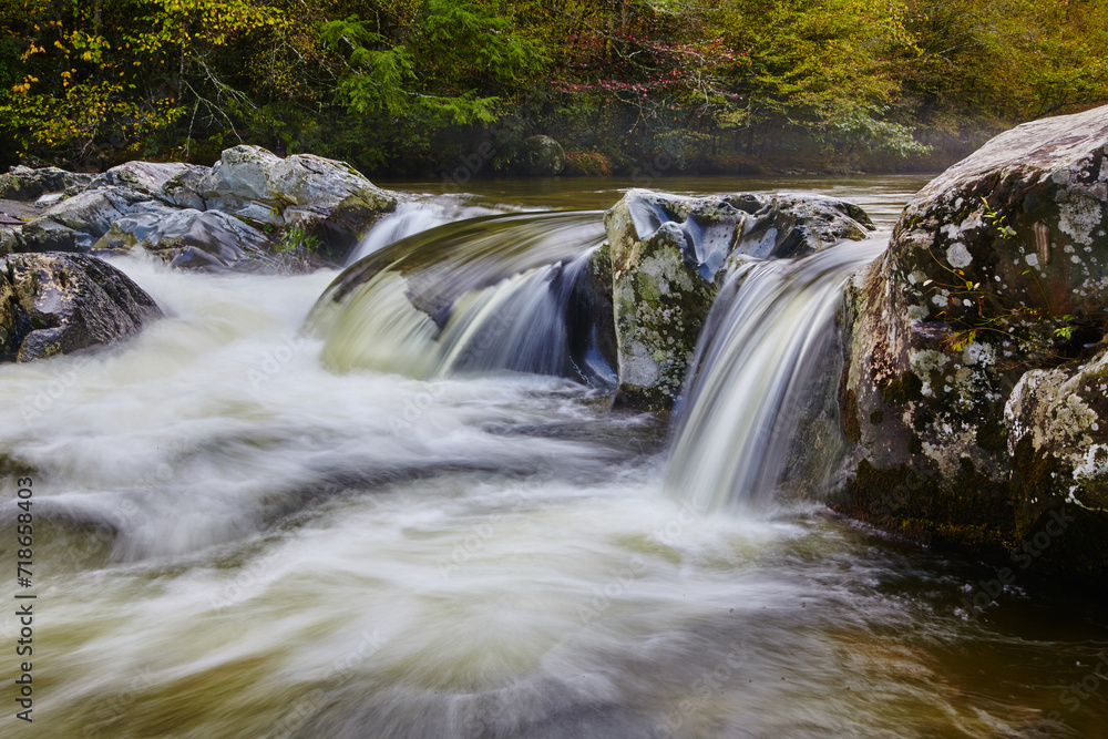 Obraz premium Serene Forest Waterfall in Autumn - Silky Water Flow Perspective