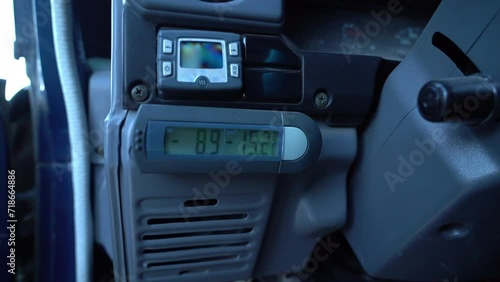 digital car thermometer showing very deep and cold temperatures of minus degrees. photo