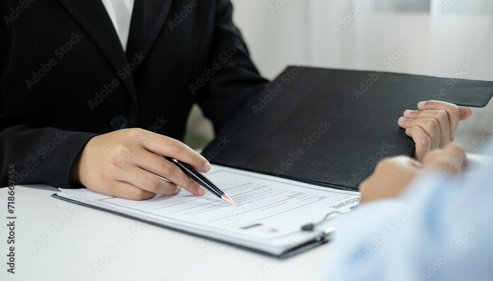 Business people hold a resume and talk to job applicants for job interviews about careers and Their personal history in the company. Recruitment concepts Business people hold a resume and talk to job applicants for job interviews about careers and Their personal history in the company. Recruitment concepts