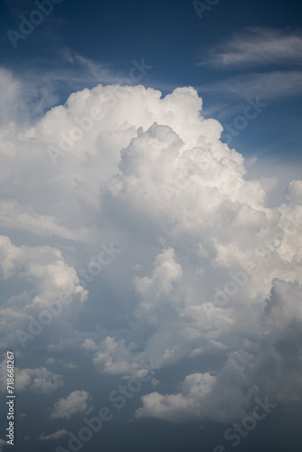 blue sky with white cumulus clouds photo