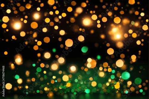 Blurred green golden lights and shining gold on black background