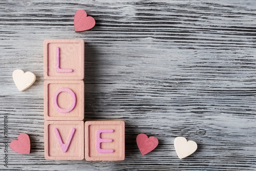 Romantic Love Message with Wooden Blocks and Hearts on Textured Background