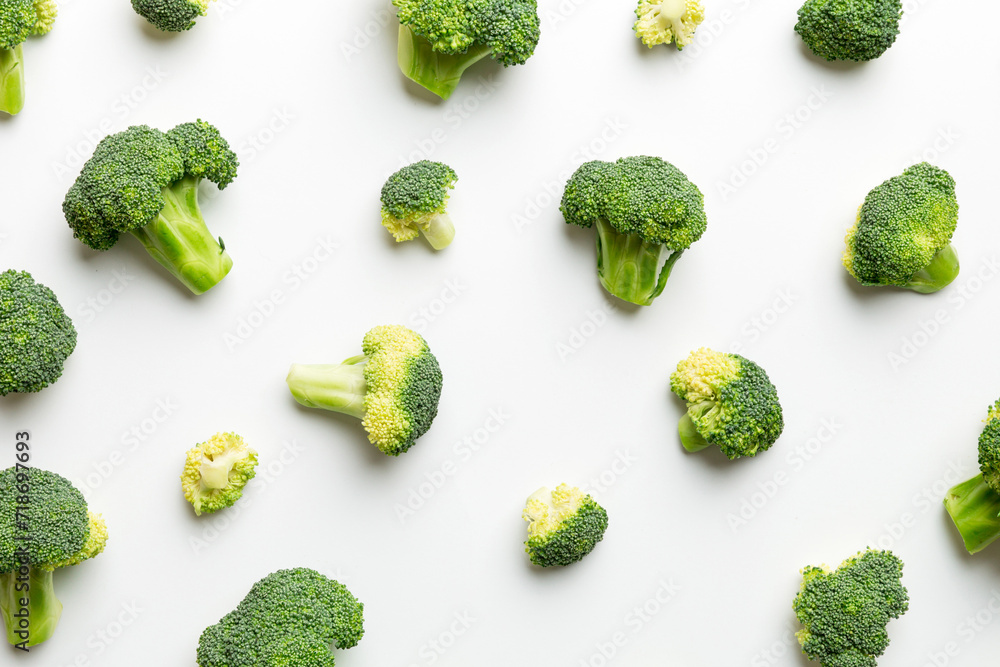 green fresh broccoli background close up on colored table. Vegetables for diet and healthy eating. Organic food green fresh broccoli background close up on colored table. Vegetables for diet and healthy eating. Organic food