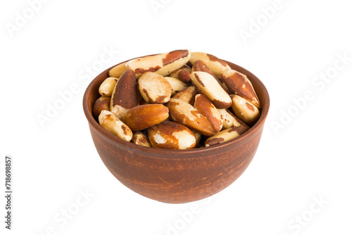 Roasted Brazil nut in bowl isolated on white background. Brazil nut is snack or raw of cook. Healthy food concept