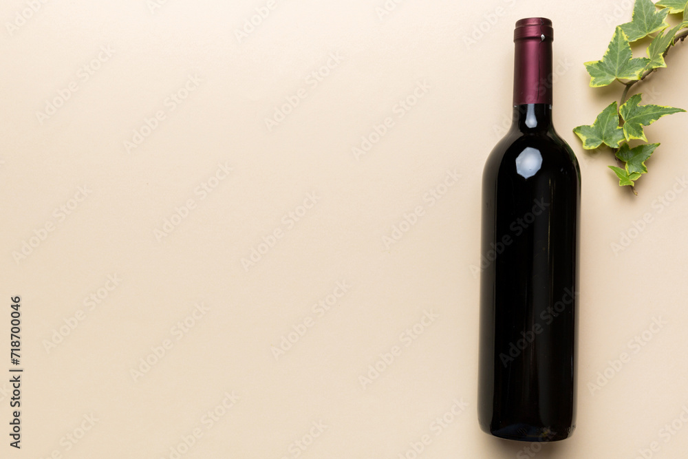 One Bottle of red wine on colored table. Flat lay, top view wth copy space One Bottle of red wine on colored table. Flat lay, top view wth copy space