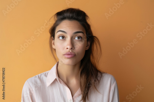 Young woman with a confused face