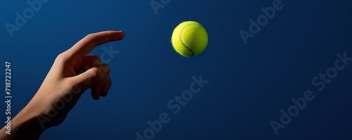 A hand and a tennis ball in the photo on a blue Background. generative AI © original logo