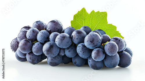 Fresh bunch of black grapes with water drops isolated on white background.