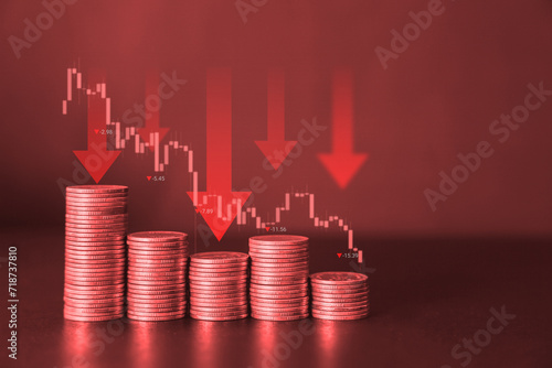 Red financial background with downward coin stack and down arrow with trading graph. Significantly deteriorated developing global recession concept. 