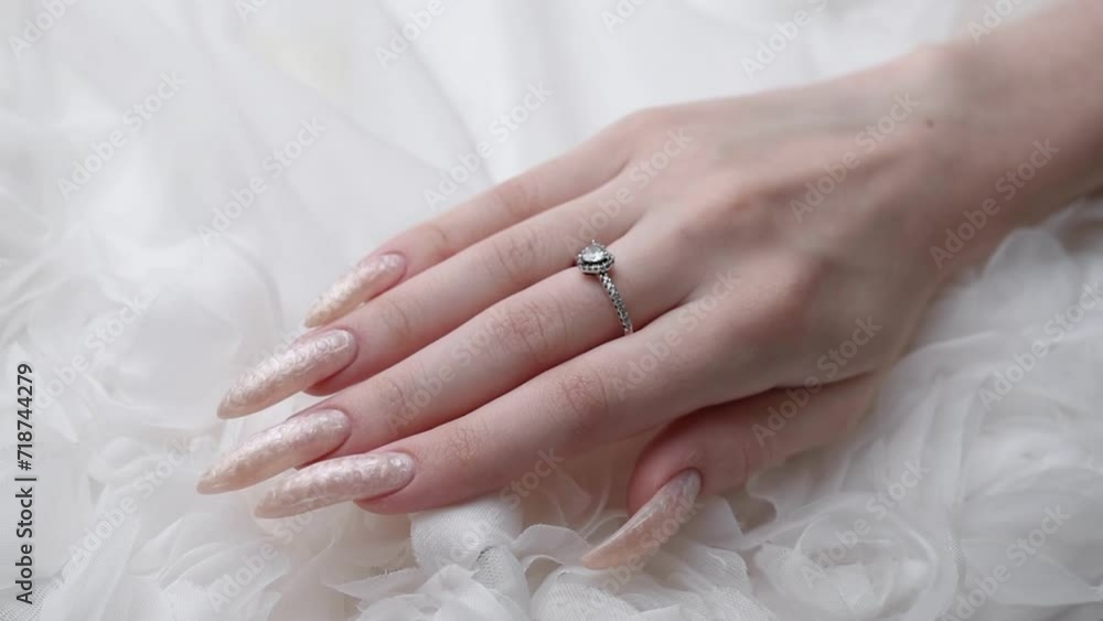 Beautiful hands of a young woman with pearl colored manicure Beautiful hands of a young woman with pearl colored manicure