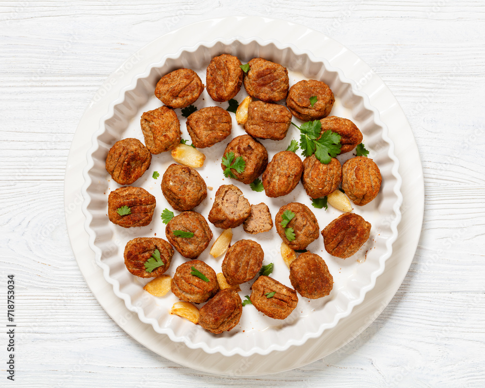 Fototapeta premium baked meatballs in white baking dish, top view
