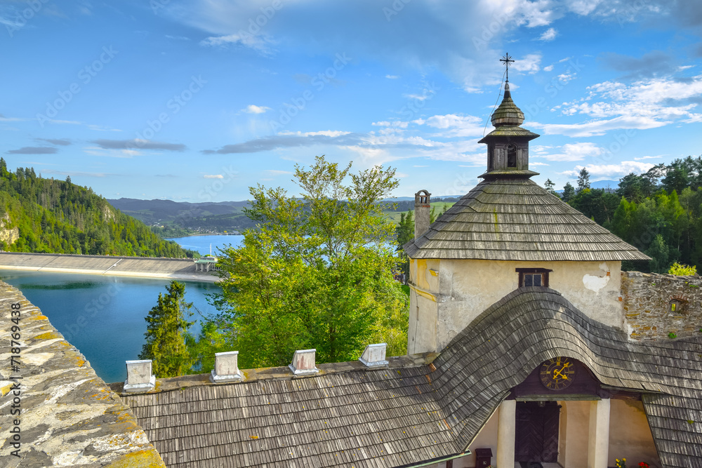 Fototapeta premium View from the Dunajec Castle in the village of Zamek-Niedzica towards Lake Czorsztynskie and the Niedzica Dam, Poland.