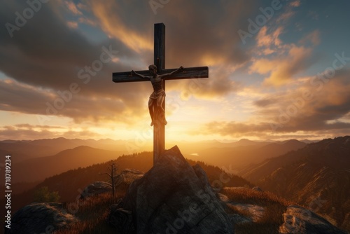 Jesus crucifix against mountain sunset photo