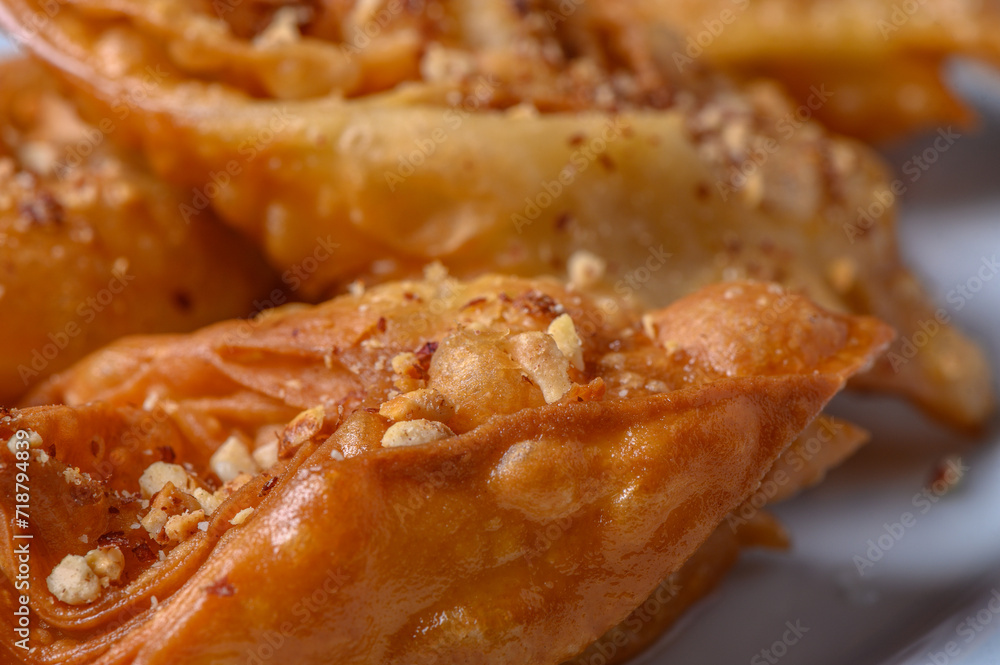 Turkish baklava, sweet dessert with honey on a light plate 6 Turkish baklava, sweet dessert with honey on a light plate 6