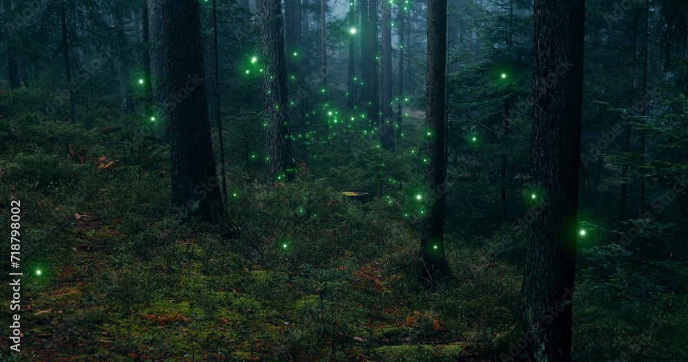 Magical green shiny fireflies flying in fairytale woods.