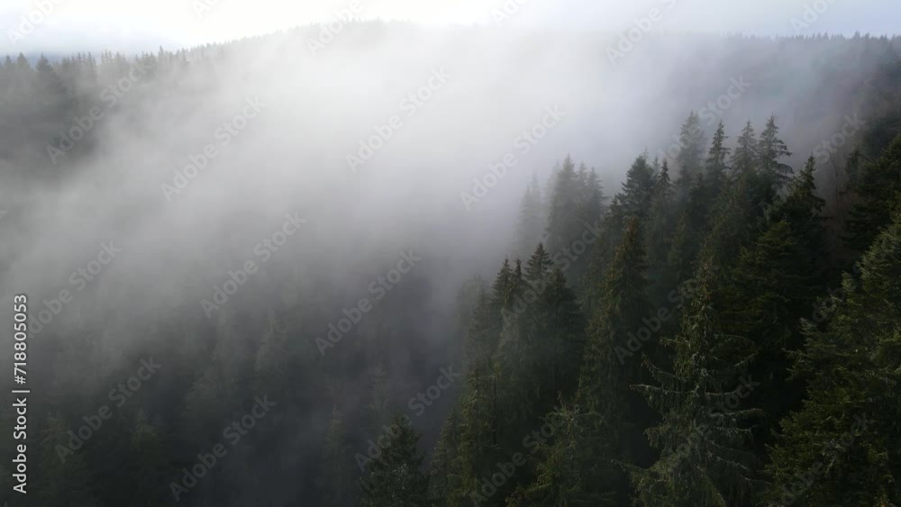 flying drone over the cloudy fog haze of the Black Forest in southern Germany. Black forest View from Mount Blauen to Belchen. flying drone over the cloudy fog haze of the Black Forest in southern Germany. Black forest View from Mount Blauen to Belchen.