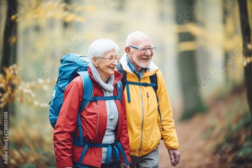 elderly duo with backpacks hiking on a forest trail