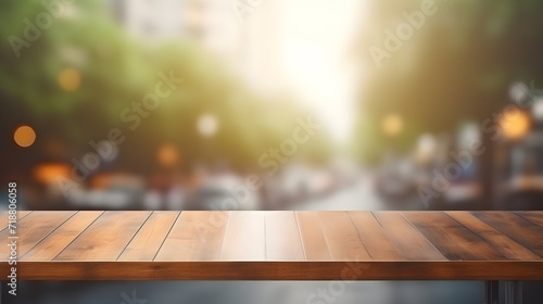 Photo of empty wooden table and restaurant sign inside blurry glass window. Abstract background mockup , wallpaper and background.