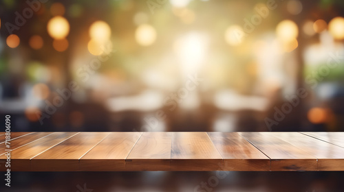 Photo of empty wooden table and restaurant sign inside blurry glass window. Abstract background mockup   wallpaper and background.