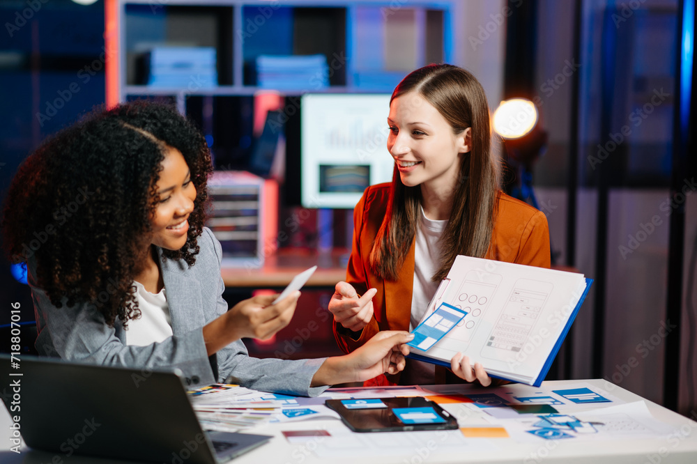 UX developer and ui designer brainstorming about mobile app interface wireframe design with customer breif and color code. UX developer and ui designer brainstorming about mobile app interface wireframe design with customer breif and color code.