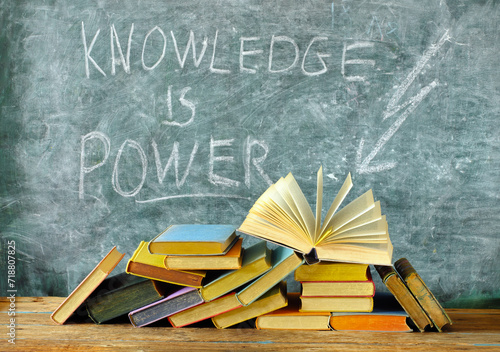knowledge is power, books and blackboard with drawing of a lightning symbol,education,learning,reading,idea,back to school concept.