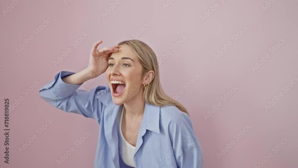 Young blonde woman wearing shirt very happy and smiling looking far away with hand over head. searching concept. over isolated pink background Young blonde woman wearing shirt very happy and smiling looking far away with hand over head. searching concept. over isolated pink background