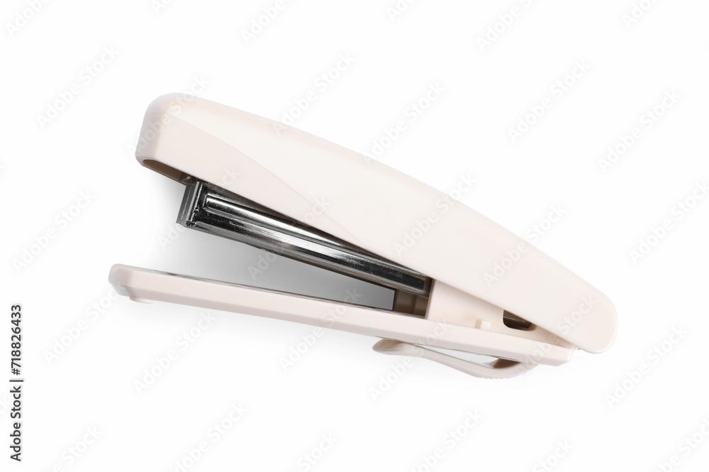 One beige stapler isolated on white, top view One beige stapler isolated on white, top view
