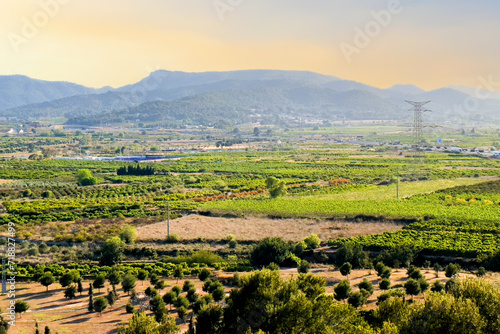 Mountains landscape sunset  Spain. Rain Clouds over mountains. Landscape of mountain valley. Farm gardens with olive and orange fields near mountains. Panorama of mountains during a thunderstorm
