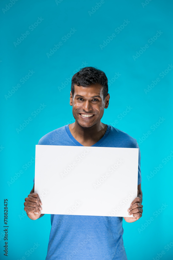 Indian man holding up a banner. Indian man holding up a banner.