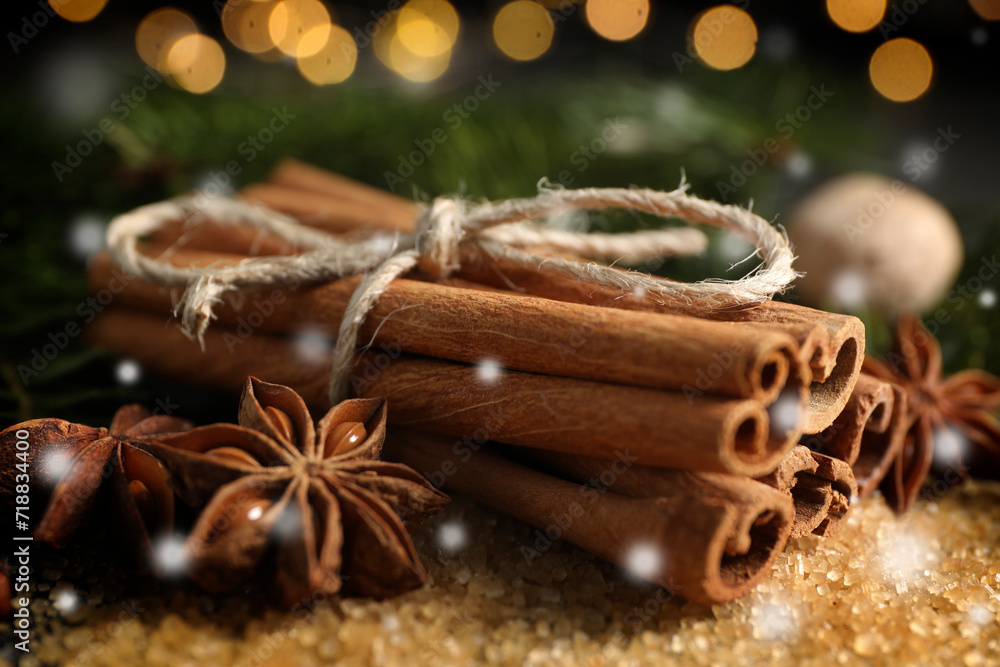 Different spices, closeup. Cinnamon, anise on brown sugar. Bokeh effect Different spices, closeup. Cinnamon, anise on brown sugar. Bokeh effect