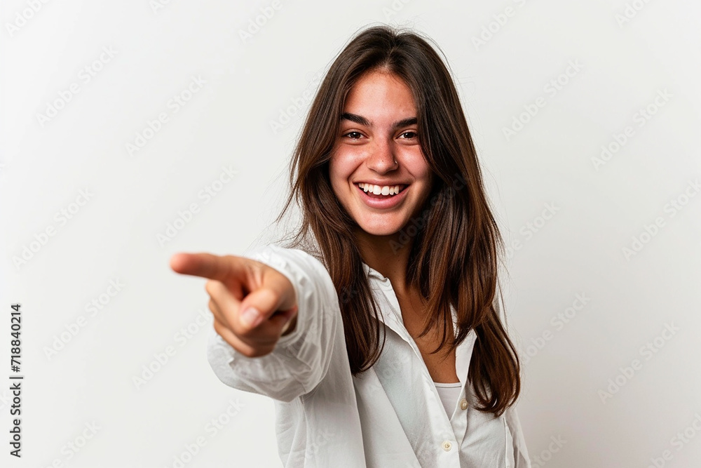 Young woman pointing front with happy expression on white isolated background Young woman pointing front with happy expression on white isolated background