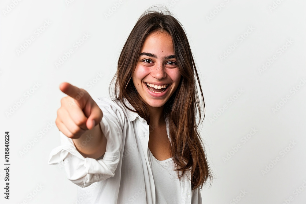 Young woman pointing front with happy expression on white isolated background Young woman pointing front with happy expression on white isolated background