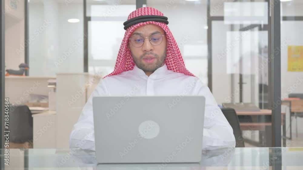 Online Video Talk via Laptop by Young Muslim Man