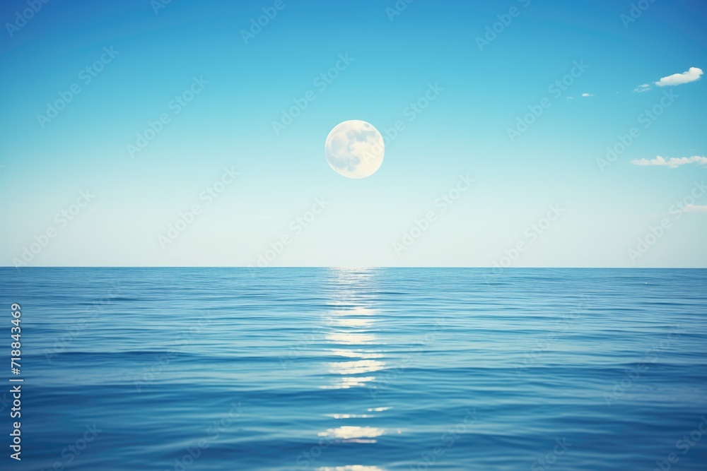 blue moon shining over calm ocean waters