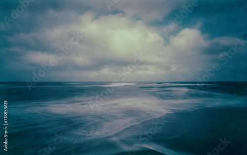 The North Sea photographed with a wooden pinhole camera  captured analogue on film. The small aperture  makes for long exposure times in which sand  sea  water  sky and clouds mix with t