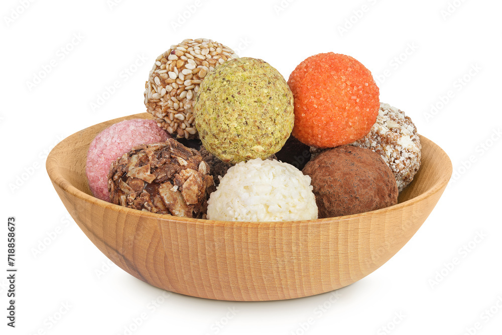 A variety of different truffles in a wooden bowl Isolated on a white background A variety of different truffles in a wooden bowl Isolated on a white background