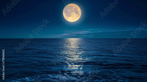 Full moon over an ocean photo