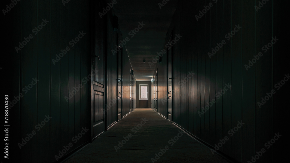 gloomy dark corridor of an empty hotel without people during quarantine