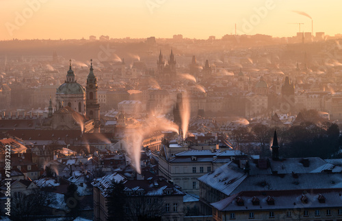 Winter Sunrise Over Prague Cityscape with Misty Atmosphere