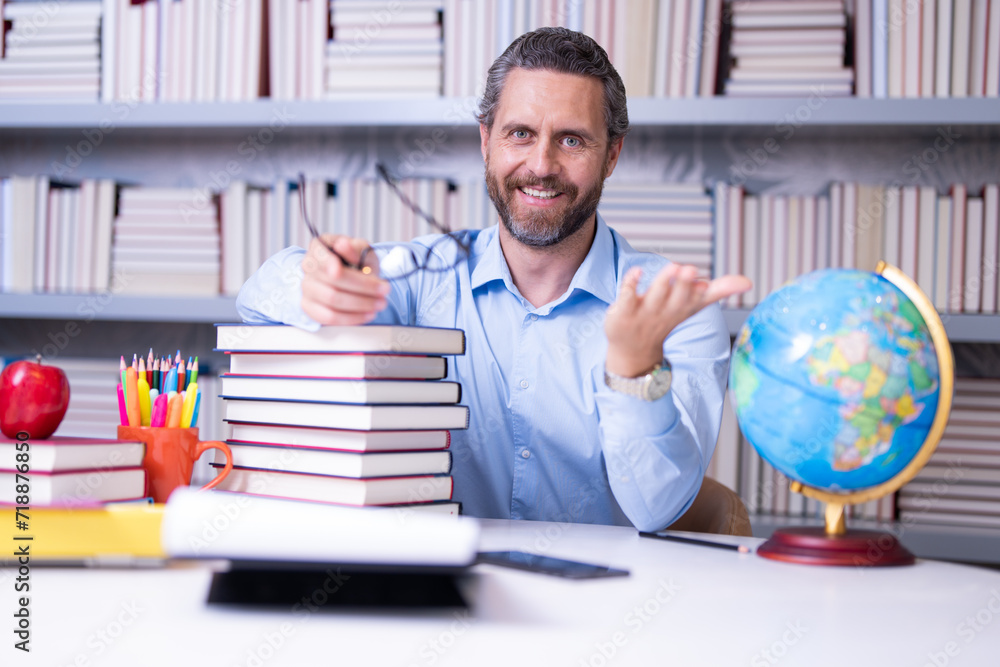 Teachers day. Teacher in school classroom. Knowledge and education with middle aged teacher. Millennial teacher with book. Man teaching lesson in class. Teachers from university exam. College teacher. Teachers day. Teacher in school classroom. Knowledge and education with middle aged teacher. Millennial teacher with book. Man teaching lesson in class. Teachers from university exam. College teacher.